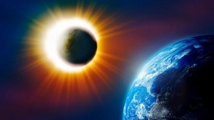Image of the moon over the front of the sun